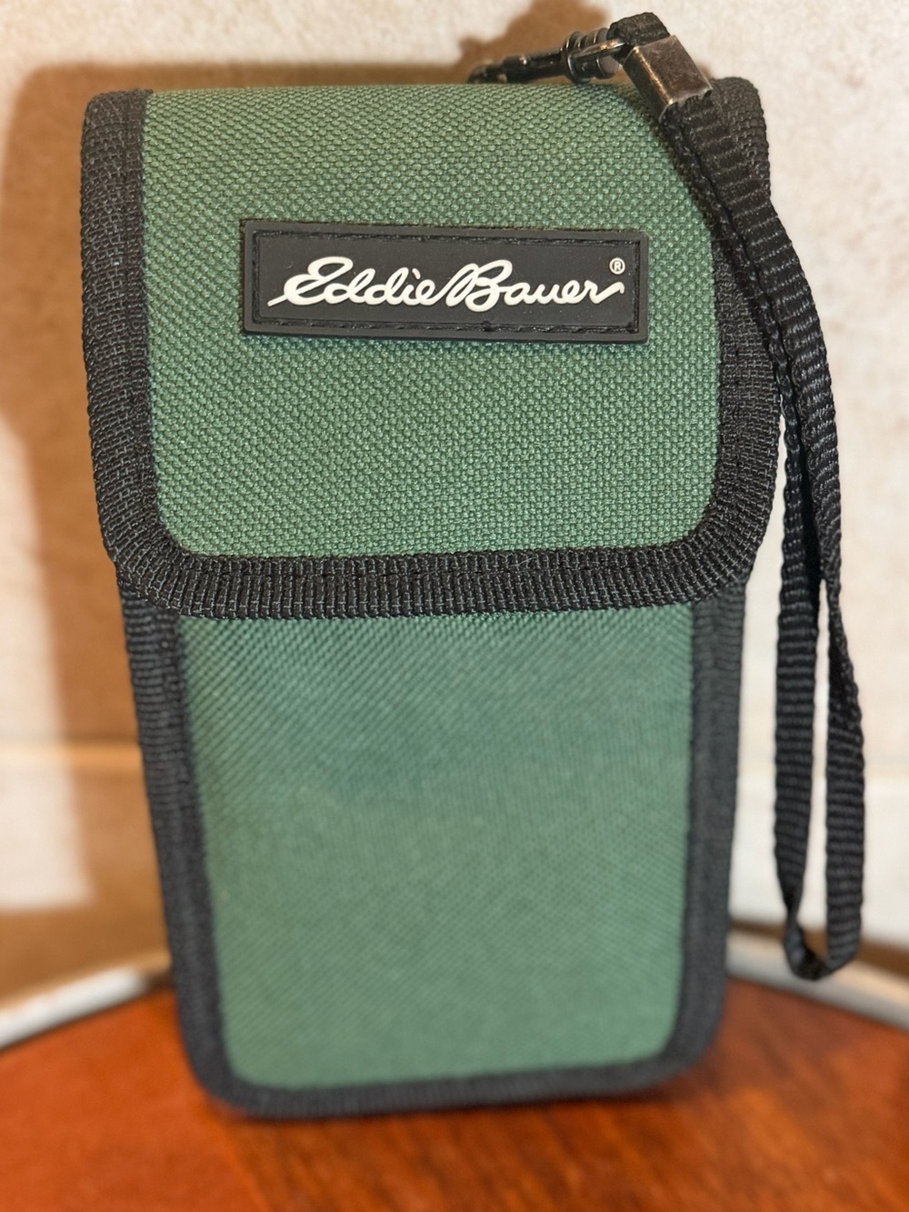 Green nylon Eddie Bauer belt pouch designed for pocket knives or small items.
